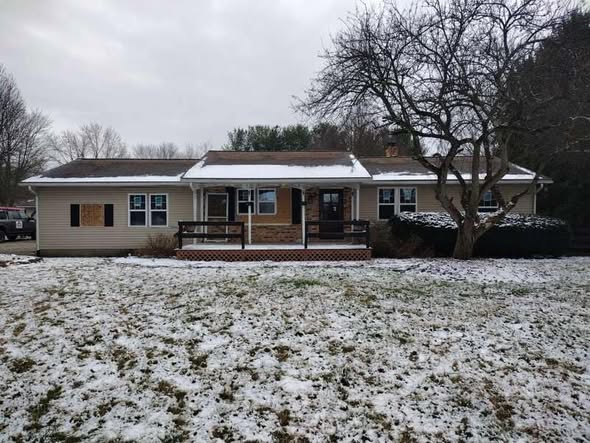 Johnstown home before new siding and gutters